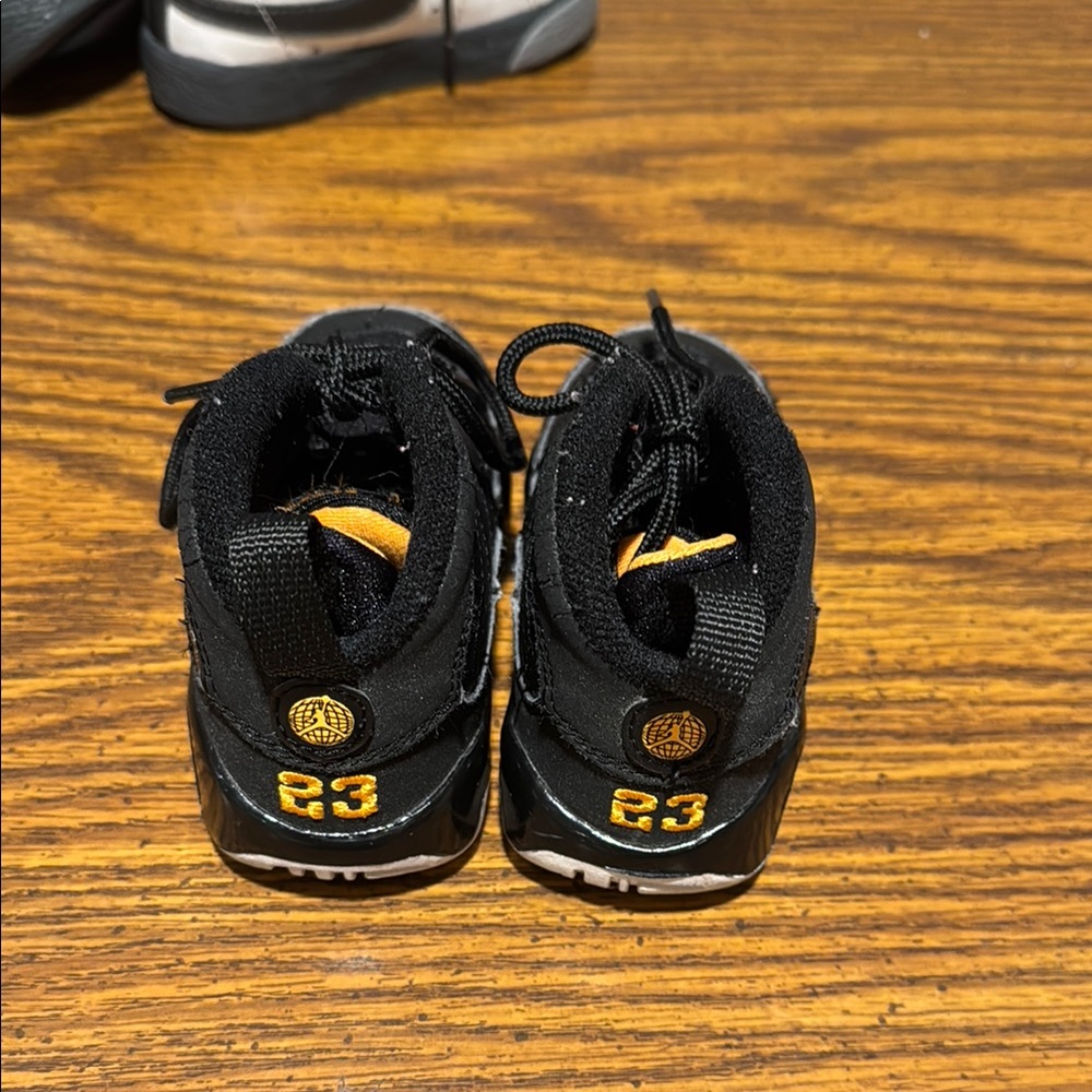 Jordan Black and Gold Sneakers with Cushioned Midsole